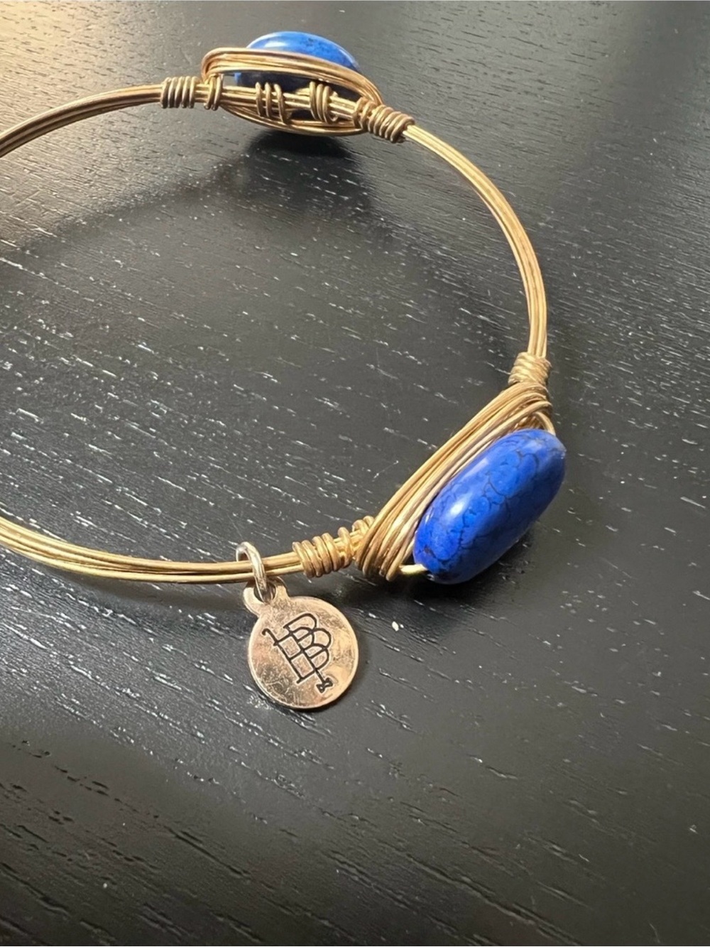 Bourbon and Bowties Gold-Tone Wire Bangle with Blue Stone Lapis
